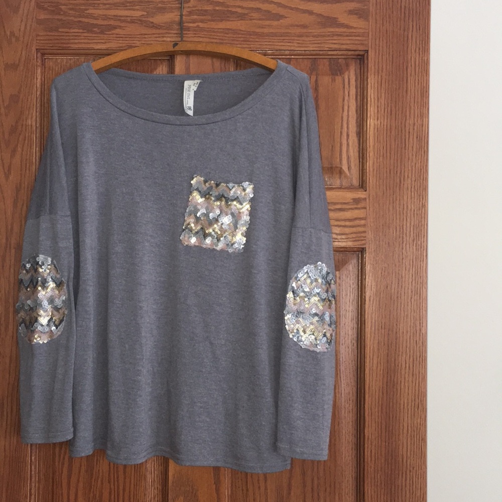 Grey sweater with sequin pocket and elbow patches